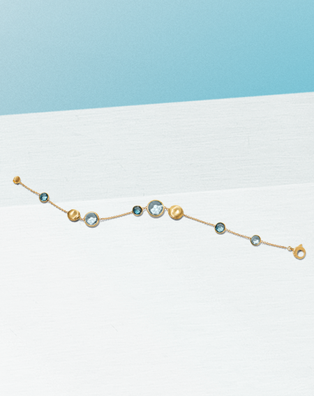 Marco Bicego bracelet on a blue background.